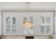 Modern dining room with stylish chandelier and bright natural light at 3111 W De Leon St # 8, Tampa, FL 33609