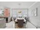 Bright dining room with modern light fixture, bar, and large windows at 3111 W De Leon St # 8, Tampa, FL 33609