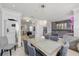 Elegant dining area with sleek lighting, gray walls, and stylish decor offers an inviting ambiance at 3111 W De Leon St # 8, Tampa, FL 33609