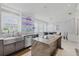 Bright kitchen with stainless steel appliances, granite island, and lighted shelves, perfect for entertaining at 3111 W De Leon St # 8, Tampa, FL 33609