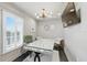 Office features a unique white desk, chandelier, plantation shutters, and a mounted TV at 3111 W De Leon St # 8, Tampa, FL 33609