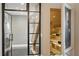 Wine cellar near the stairs, portrait on the wall, glass door at 3111 W De Leon St # 8, Tampa, FL 33609