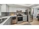 Bright kitchen features stainless steel appliances, stylish backsplash, and ample counter space at 3272 Lake Bayshore Dr # 515, Bradenton, FL 34205