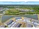 Aerial shot of modern townhomes surrounded by lush landscaping and serene lakes at 33030 Major Oak Dr, Wesley Chapel, FL 33545