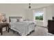 Neutral bedroom with a window and side table at 33030 Major Oak Dr, Wesley Chapel, FL 33545