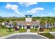 Clubhouse with manicured landscaping, Westgate Avalon Park signage, and pedestrian access at 33030 Major Oak Dr, Wesley Chapel, FL 33545