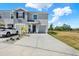 Charming townhome with a private entrance, attached garage, and a well-manicured front yard at 33030 Major Oak Dr, Wesley Chapel, FL 33545