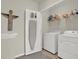 Bright laundry room with washer and dryer at 33030 Major Oak Dr, Wesley Chapel, FL 33545