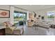 Cozy living room with neutral tones, comfortable seating, and scenic outdoor views at 33030 Major Oak Dr, Wesley Chapel, FL 33545
