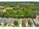 Aerial view showcasing the lush green trees behind the houses in the area at 3315 Granite Ridge Loop, Land O Lakes, FL 34638