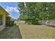 Spacious backyard with lush green grass, mature trees, and privacy fence at 3315 Granite Ridge Loop, Land O Lakes, FL 34638