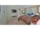 Bedroom featuring a TV, access to the patio, and comfortable space for living at 3315 Granite Ridge Loop, Land O Lakes, FL 34638