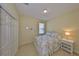 Cozy bedroom with neutral walls, closet, and window at 3315 Granite Ridge Loop, Land O Lakes, FL 34638