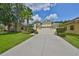 Charming single-story home with a two-car garage and well-manicured landscaping at 3315 Granite Ridge Loop, Land O Lakes, FL 34638