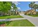 Inviting single-story home with a well-maintained lawn and mature palm trees at 3315 Granite Ridge Loop, Land O Lakes, FL 34638