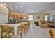 Open-concept living area showcasing a kitchen with bar seating and a comfortable living room at 3315 Granite Ridge Loop, Land O Lakes, FL 34638