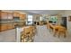 Open-concept living area with a modern kitchen, dining area, and comfortable living space at 3315 Granite Ridge Loop, Land O Lakes, FL 34638