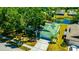 Aerial view highlights the home's landscaping, solar panels, and proximity to a pond at 3414 Rankin Dr, New Port Richey, FL 34655