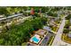 A nice aerial view features the community pool, surrounded by landscaped grounds in the neighborhood at 3414 Rankin Dr, New Port Richey, FL 34655