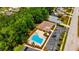Aerial view of the community clubhouse and pool, surrounded by landscaped grounds and parking at 3414 Rankin Dr, New Port Richey, FL 34655