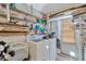 Functional laundry room with shelving, washer, and dryer for added convenience at 3414 Rankin Dr, New Port Richey, FL 34655
