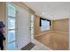 Inviting living room with wood-look flooring and a window with decorative curtains at 3414 Rankin Dr, New Port Richey, FL 34655