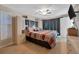 Cozy bedroom with built-in storage, neutral walls, and a ceiling fan for comfortable living at 3414 Rankin Dr, New Port Richey, FL 34655