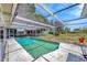 Inviting screened-in pool offering ample space for relaxation and outdoor enjoyment in a private setting at 3414 Rankin Dr, New Port Richey, FL 34655