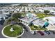 Overhead view of the clubhouse, manicured grounds, and community pool, enhancing the neighborhood appeal at 34506 Rose N Dr, Pinellas Park, FL 33781