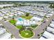 Aerial shot of community center and pool nestled among many homes in a vibrant community at 34506 Rose N Dr, Pinellas Park, FL 33781