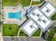 Overhead aerial view of community pool and recreation facilities in a well-maintained neighborhood at 34506 Rose N Dr, Pinellas Park, FL 33781