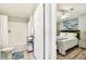 View from the doorway of a bedroom with light green walls and a beach themed painting at 34506 Rose N Dr, Pinellas Park, FL 33781