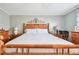 Comfortable bedroom featuring wood floors, wood furniture, and ample natural light at 34506 Rose N Dr, Pinellas Park, FL 33781