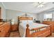 Bedroom with wood floors, a wooden bed frame, and coordinating furniture at 34506 Rose N Dr, Pinellas Park, FL 33781