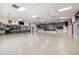 Large community room featuring a stage, kitchen, and seating areas ideal for events and socializing at 34506 Rose N Dr, Pinellas Park, FL 33781