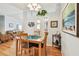 Bright dining area with wood flooring, a wooden table and chairs, and natural light at 34506 Rose N Dr, Pinellas Park, FL 33781