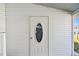 Charming front door with decorative window and sidelight at 34506 Rose N Dr, Pinellas Park, FL 33781