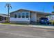 Charming manufactured home featuring a covered carport and well-maintained landscaping at 34506 Rose N Dr, Pinellas Park, FL 33781