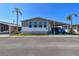 Charming single-story home with three front-facing windows, carport, and well-maintained landscaping at 34506 Rose N Dr, Pinellas Park, FL 33781