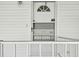 Inviting front entrance with a secure storm door and white trim details at 34506 Rose N Dr, Pinellas Park, FL 33781