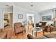 Inviting living room with hardwood floors, ample seating, and an open floor plan at 34506 Rose N Dr, Pinellas Park, FL 33781