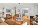 Expansive living room with hardwood floors, comfortable seating, and seamless transitions to other living spaces at 34506 Rose N Dr, Pinellas Park, FL 33781