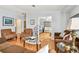 Cozy living room featuring hardwood floors, comfortable seating, and an open layout at 34506 Rose N Dr, Pinellas Park, FL 33781