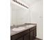 Bathroom boasts a double sink vanity with a large mirror and vanity lights at 3503 Diamond Leaf Ct, Valrico, FL 33594