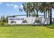 Community entrance sign with lush landscaping and manicured lawn, creating an inviting first impression at 3652 Forest Path Dr, Plant City, FL 33565