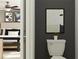 Bathroom featuring modern toilet, neutral color scheme, and tasteful wall art at 3711 Forest Path Dr, Plant City, FL 33565