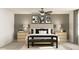Bedroom with neutral tones, ceiling fan, and coordinated modern artwork at 3711 Forest Path Dr, Plant City, FL 33565