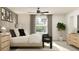 Bright bedroom featuring a large window, ceiling fan, and stylish decor at 3711 Forest Path Dr, Plant City, FL 33565