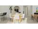 Bright dining area with a modern table setting, stylish chairs, and contemporary decor at 3711 Forest Path Dr, Plant City, FL 33565