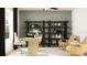 Well-lit office featuring modern desk, ergonomic chair, shelving unit, and neutral color palette at 3711 Forest Path Dr, Plant City, FL 33565